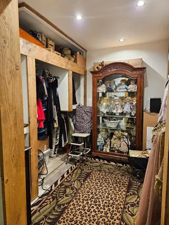 a room with lots of furniture and white walls