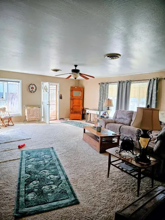 a living room with furniture and a rug