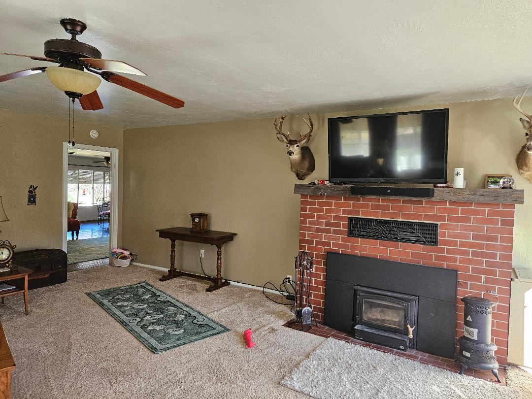 653 Center Street Princeton, CA 95970 - Photo 5 of 13 a living room with furniture and a flat screen tv