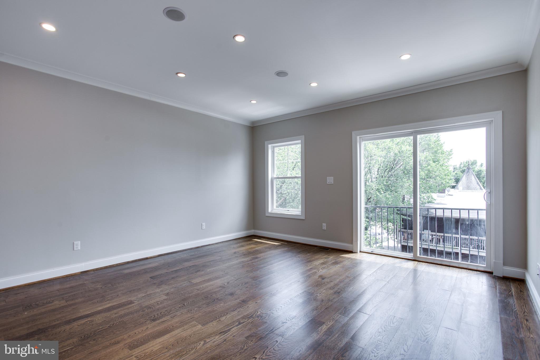 39 U Street Northeast, Unit 2 Washington, DC 20002 - Photo 18 of 29 Guest bedroom on second level w/ Juliette balcony