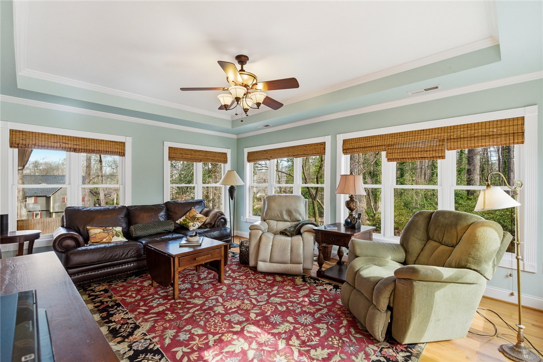 106 Cherokee Circle Anderson, SC 29621 - Photo 24 of 47 Bright and airy living room with a unique tray ceiling and abundant natural light.