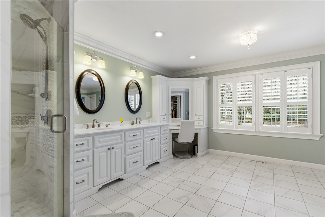 106 Cherokee Circle Anderson, SC 29621 - Photo 29 of 47 This spacious bathroom offers a double vanity and an elegant shower, providing comfort and style.