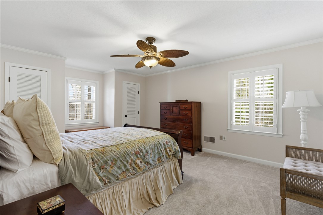 106 Cherokee Circle Anderson, SC 29621 - Photo 32 of 47 This tranquil bedroom features classic architectural elements and abundant natural light.