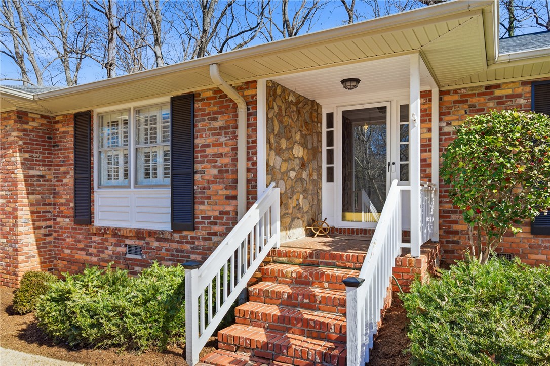 106 Cherokee Circle Anderson, SC 29621 - Photo 4 of 47 This charming residence features a classic brick exterior and an inviting entryway.