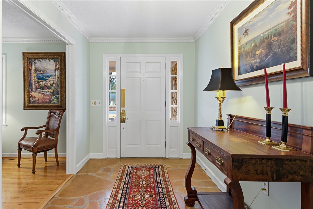 106 Cherokee Circle Anderson, SC 29621 - Photo 5 of 47 This inviting entryway features natural stone flooring and elegant crown molding.