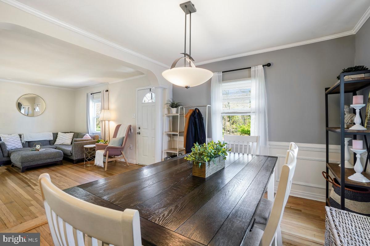 4206 Dahill Road Silver Spring, MD 20906 - Photo 11 of 33 a living room with furniture and a chandelier