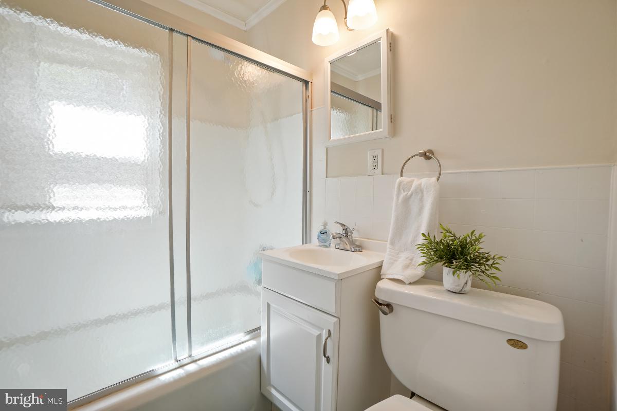 4206 Dahill Road Silver Spring, MD 20906 - Photo 14 of 33 a bathroom with a sink toilet and a mirror
