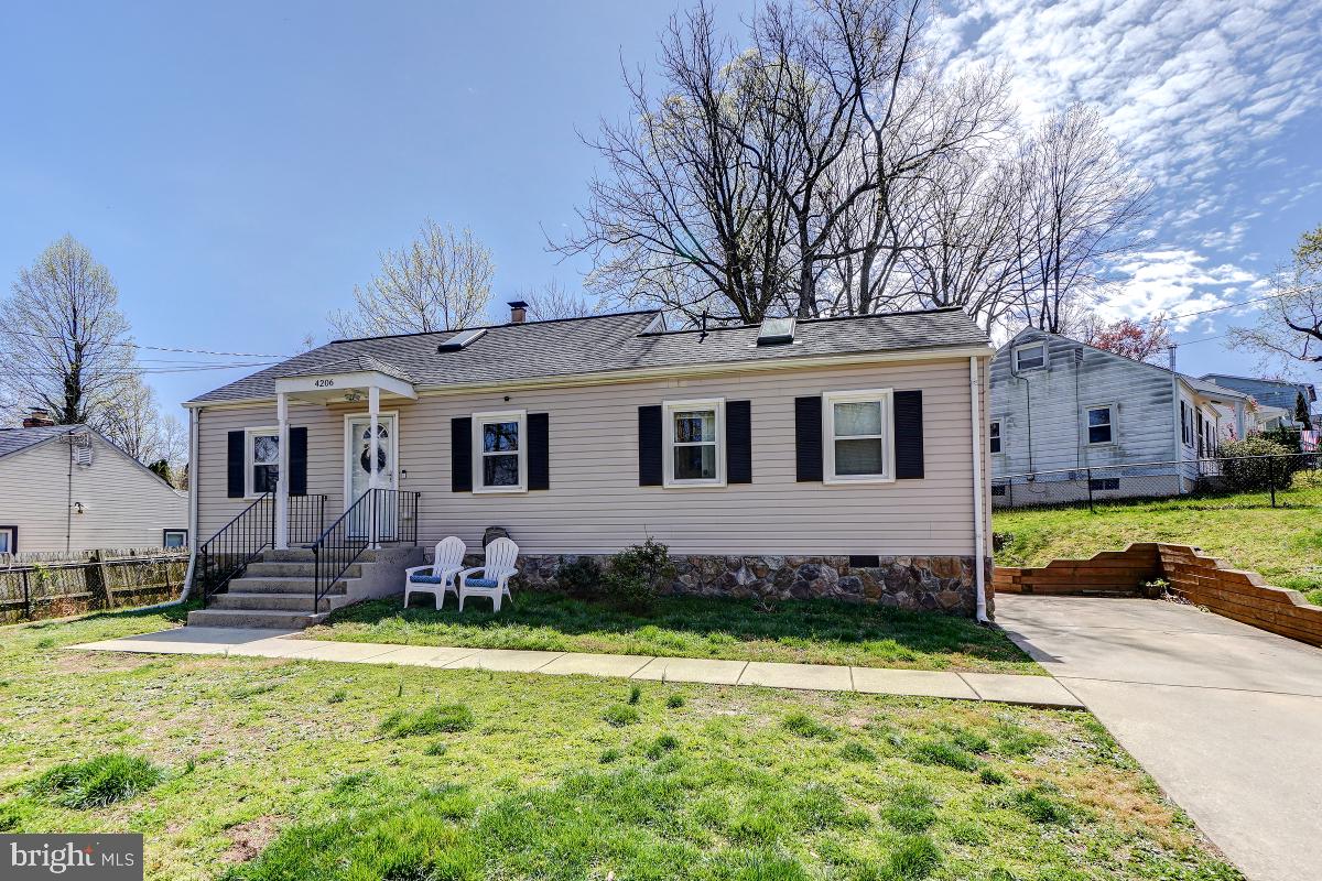 4206 Dahill Road Silver Spring, MD 20906 - Photo 2 of 33 a front view of a house with a yard