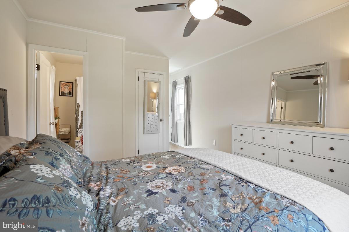 4206 Dahill Road Silver Spring, MD 20906 - Photo 21 of 33 a bedroom with a bed and a mirror on dresser