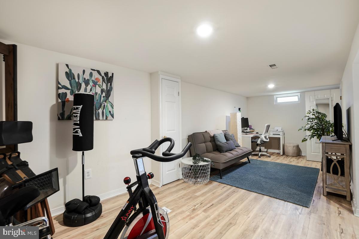4206 Dahill Road Silver Spring, MD 20906 - Photo 26 of 33 a living room with furniture and a wooden floor