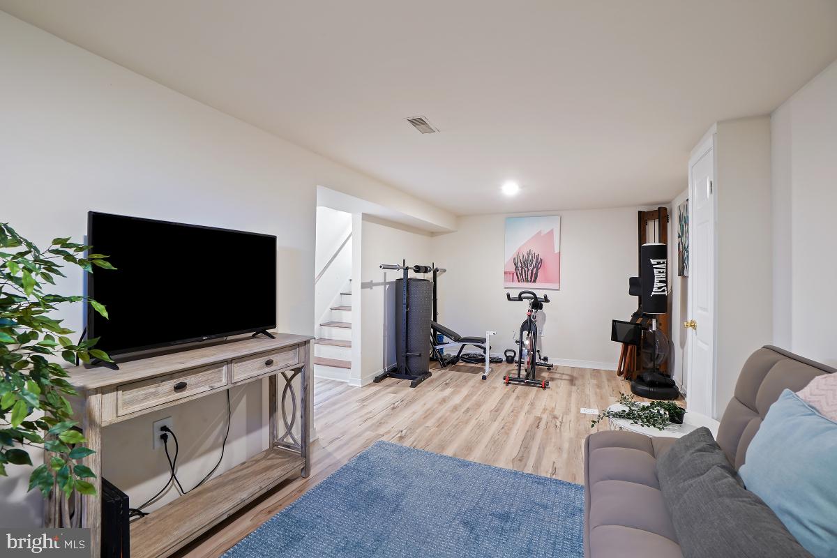 4206 Dahill Road Silver Spring, MD 20906 - Photo 28 of 33 a living room with furniture and a flat screen tv