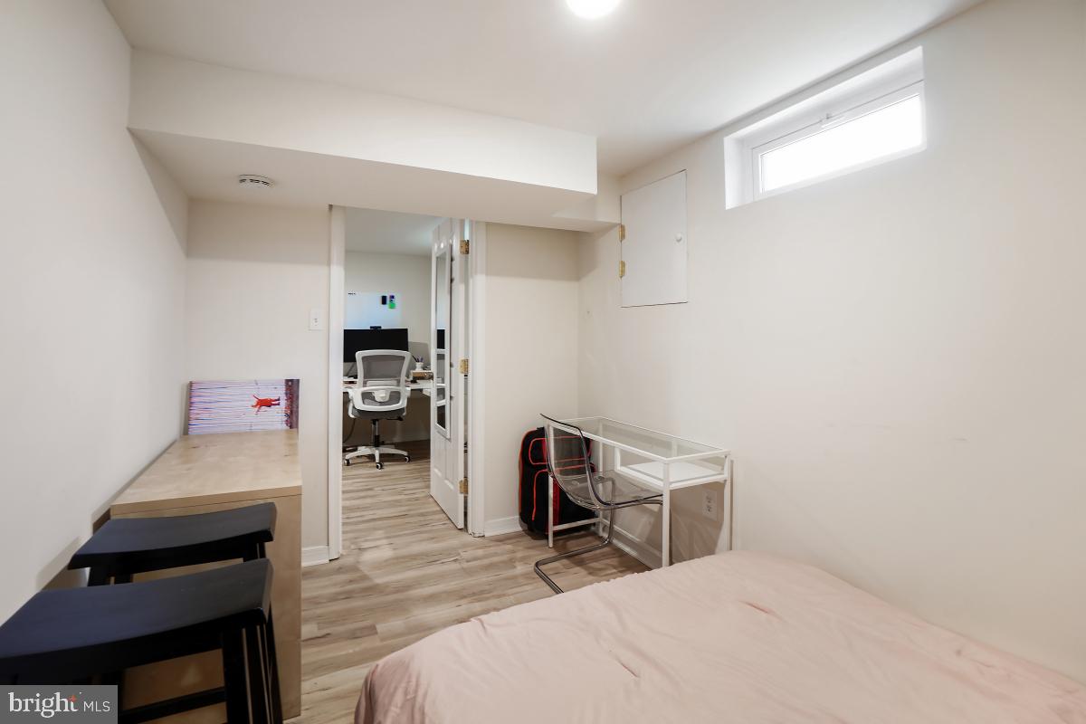 4206 Dahill Road Silver Spring, MD 20906 - Photo 30 of 33 a room that has a bed and a chair in it