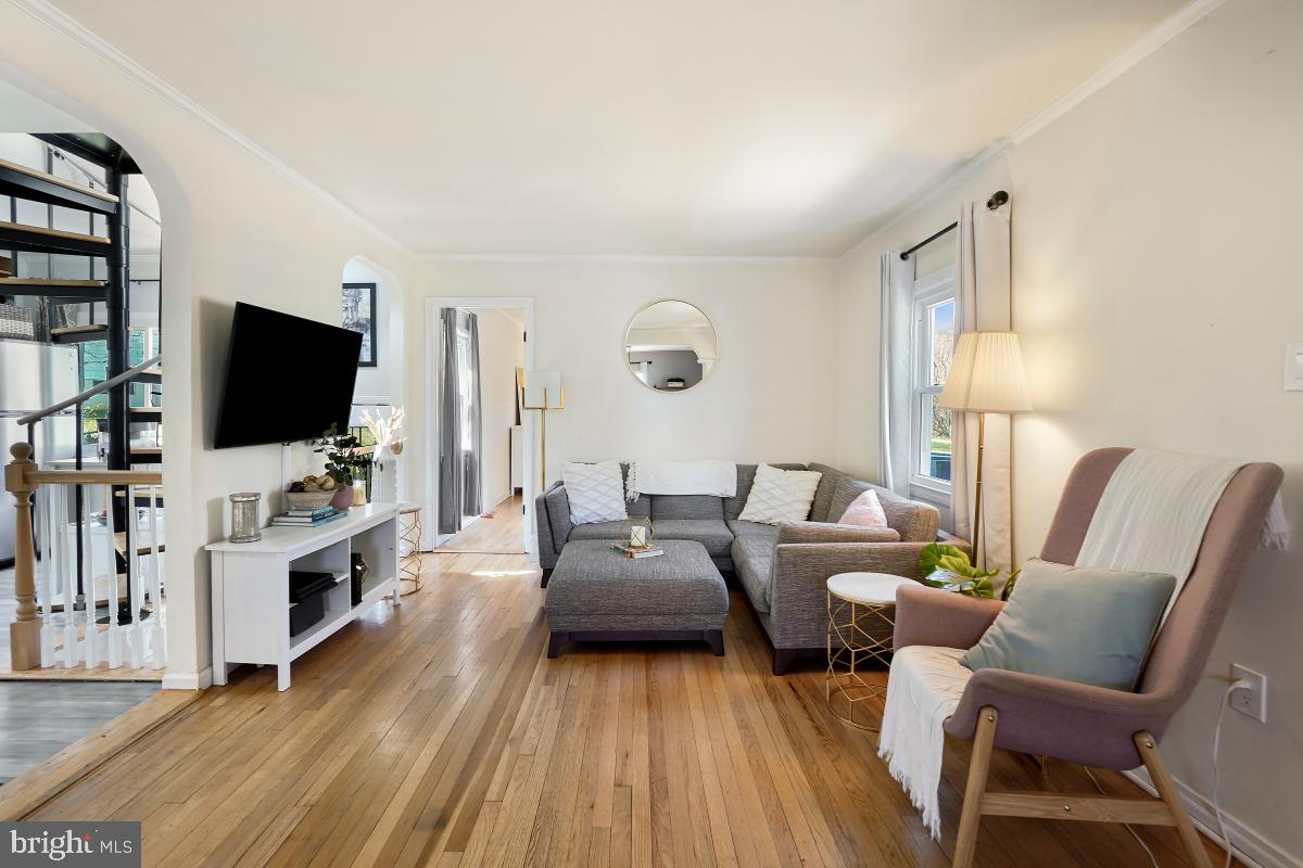 4206 Dahill Road Silver Spring, MD 20906 - Photo 5 of 33 a living room with furniture and a flat screen tv