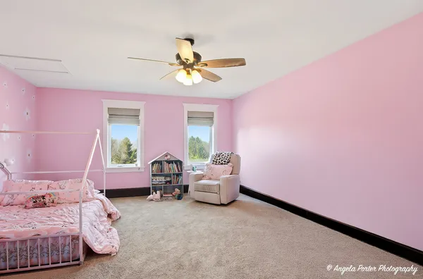a bedroom with furniture and a window
