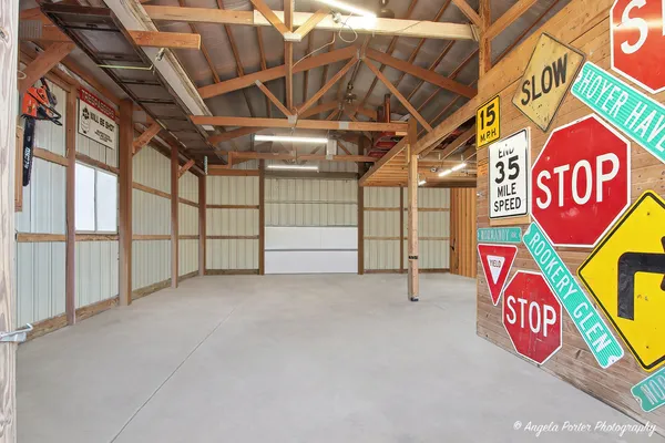 a backyard of a house with lots of green space and outdoor seating