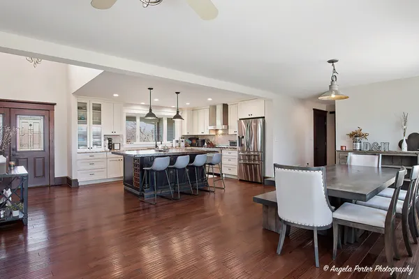 a view of a dining room with furniture and wooden floor