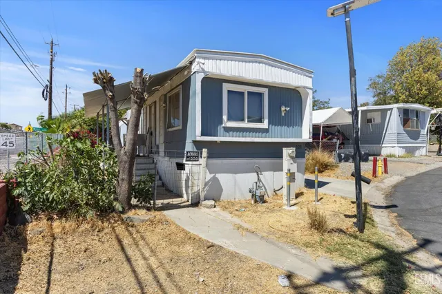 a front view of a house with snow