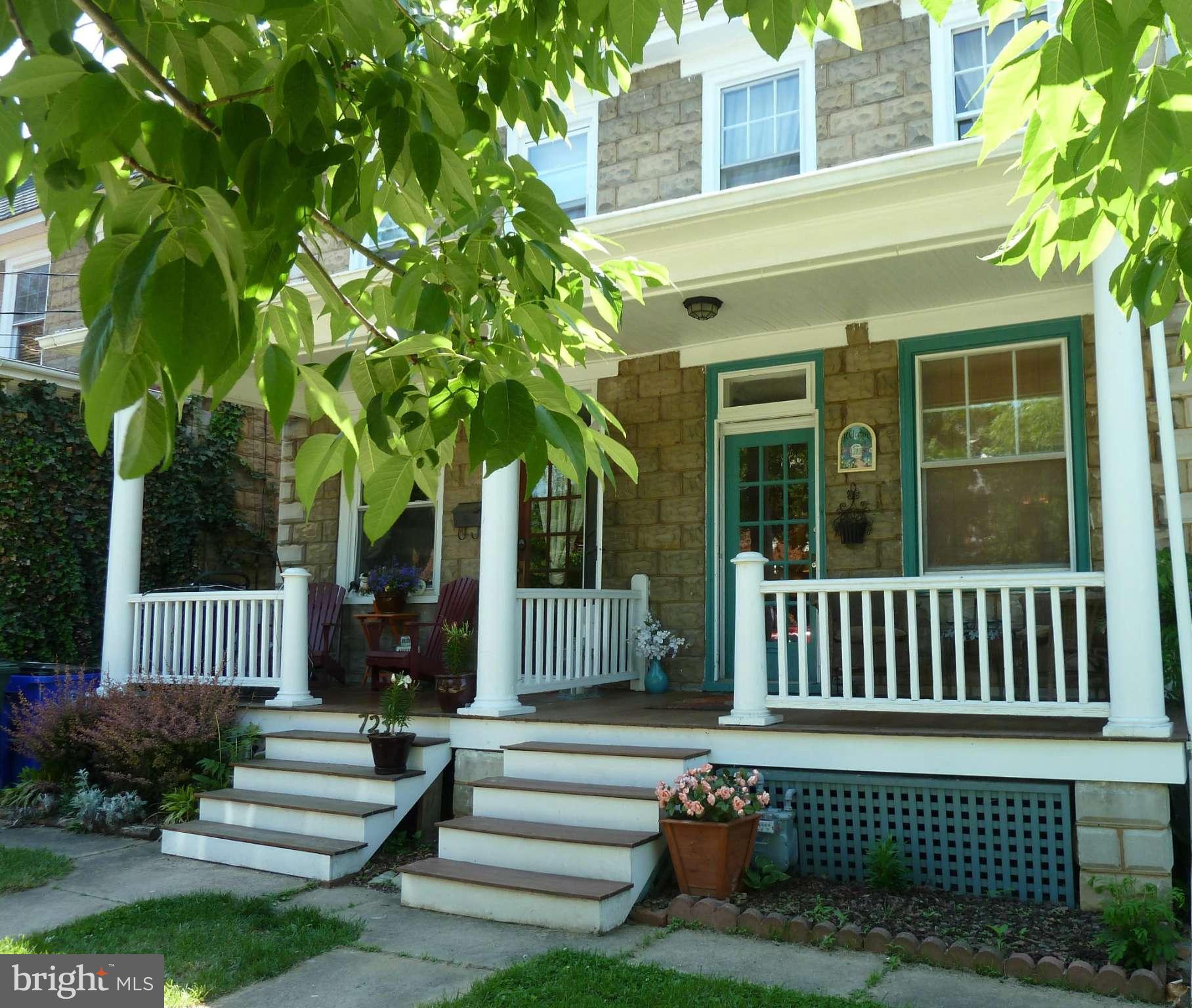 a view of a brick house with a yard