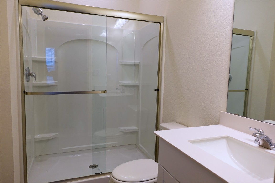 402 Plateau Street Maxwell, TX 78656 - Photo 11 of 18 a bathroom with a sink toilet and shower
