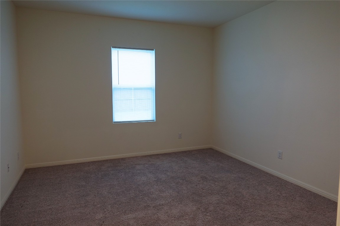 402 Plateau Street Maxwell, TX 78656 - Photo 8 of 18 an empty room with a window