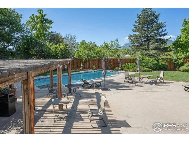 a view of a backyard with sitting area