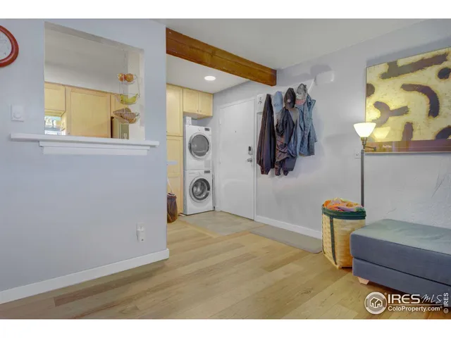 a view of an entryway and wooden floor