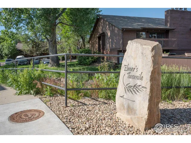 a view of a wooden fence and a park view