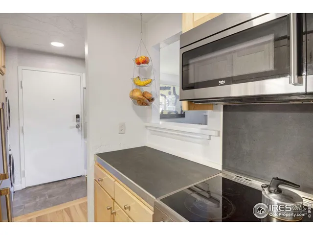 a kitchen with a sink and a microwave