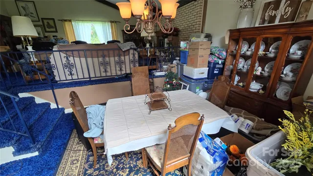 a view of a dining room with furniture and toys