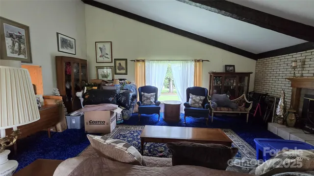 a living room with furniture couches and a flat screen tv