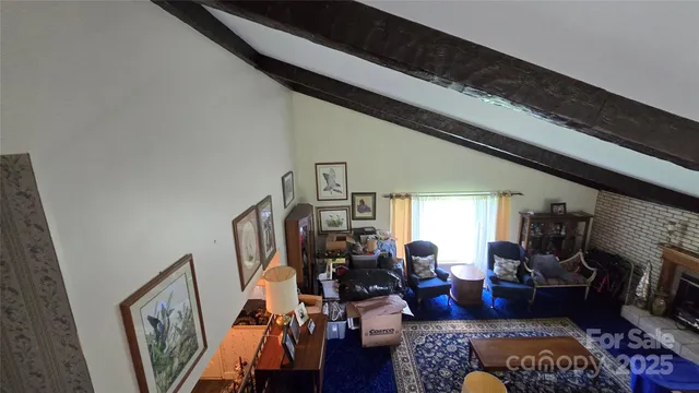 a living room with lots of furniture and white walls