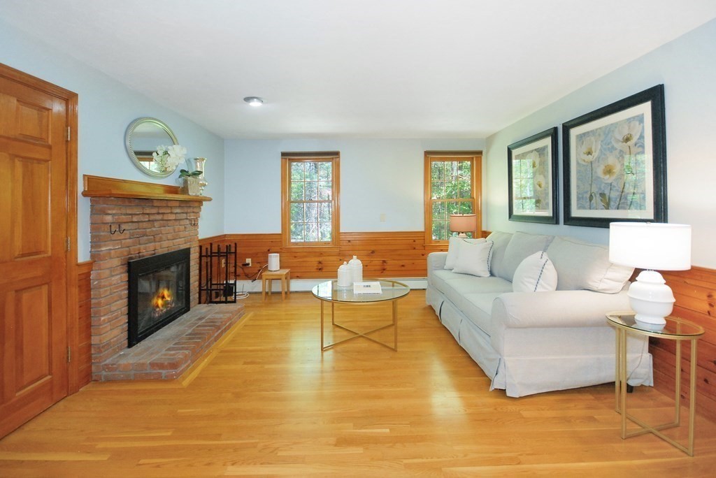 22 Taylor Road Stow, MA 01775 - Photo 13 of 32 a living room with furniture and a fireplace