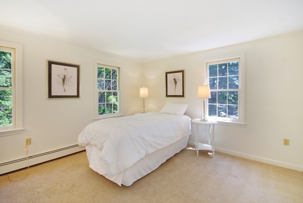 22 Taylor Road Stow, MA 01775 - Photo 19 of 32 a bedroom with a bed and a window