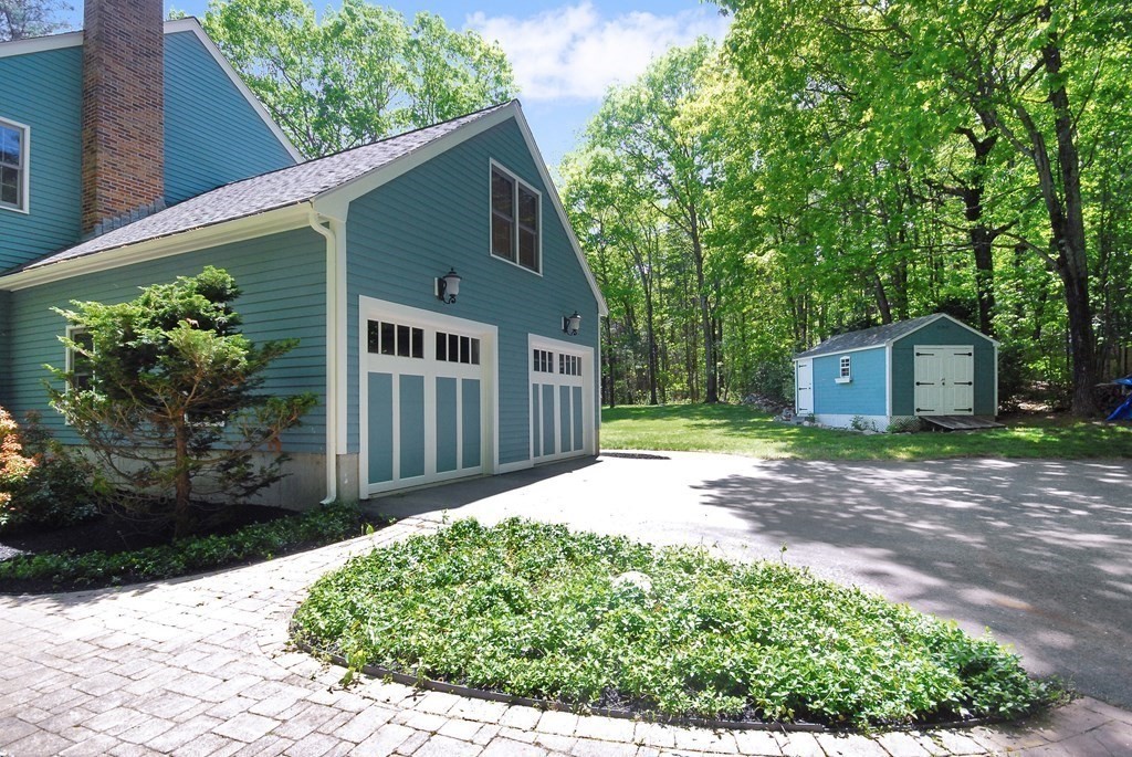 22 Taylor Road Stow, MA 01775 - Photo 2 of 32 a front view of a house with a yard