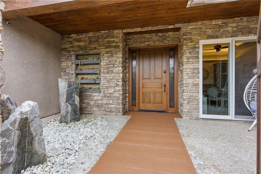 29131 Bouquet Canyon Road Silverado, CA 92676 - Photo 11 of 74 Front courtyard entry with waterfall feature, living plant wall, covered porch and wood front door