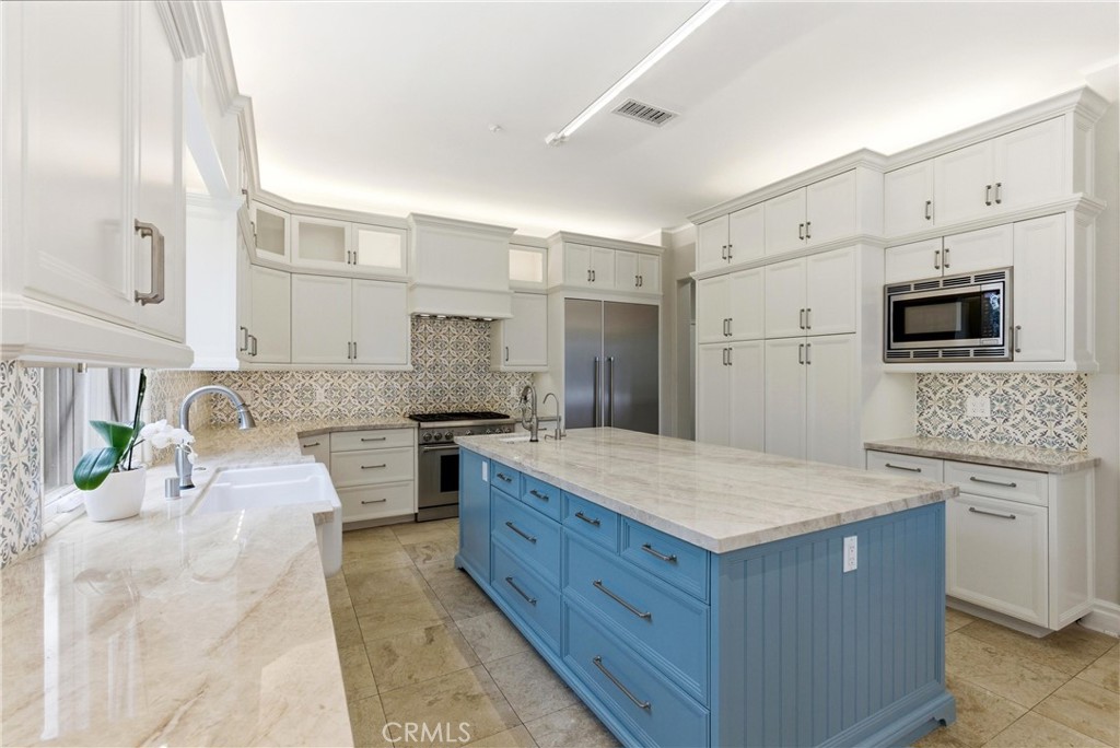 29131 Bouquet Canyon Road Silverado, CA 92676 - Photo 14 of 74 a kitchen with a stove a sink and a refrigerator