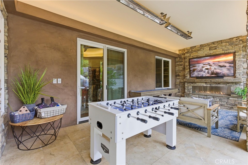 29131 Bouquet Canyon Road Silverado, CA 92676 - Photo 21 of 74 Outdoor lounge area with fireplace and TV entertainment wall