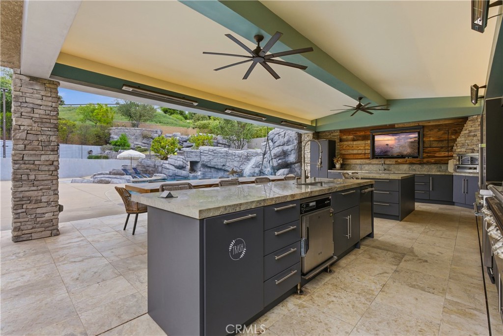29131 Bouquet Canyon Road Silverado, CA 92676 - Photo 25 of 74 a kitchen with stainless steel appliances granite countertop a stove and a sink
