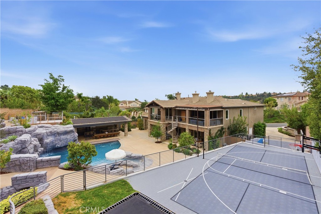 29131 Bouquet Canyon Road Silverado, CA 92676 - Photo 32 of 74 a view of a patio with couches table and chairs with potted plants and big yard