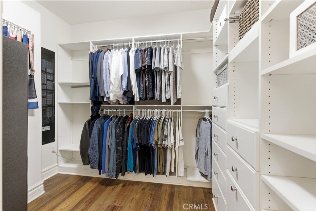29131 Bouquet Canyon Road Silverado, CA 92676 - Photo 50 of 74 a view of walk in closet with clothes and shoes