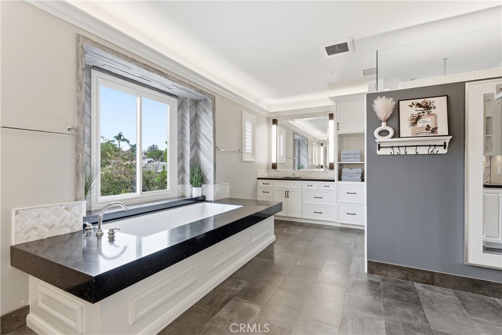 29131 Bouquet Canyon Road Silverado, CA 92676 - Photo 51 of 74 large primary suitr with dual seperate vanaties, large soaker tub, walk in shower, and vanity area.