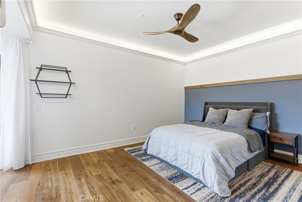 29131 Bouquet Canyon Road Silverado, CA 92676 - Photo 60 of 74 a bedroom with a bed and a painting on the wall