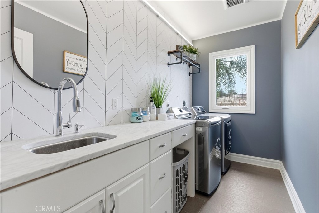 29131 Bouquet Canyon Road Silverado, CA 92676 - Photo 63 of 74 a bathroom with a sink and a mirror