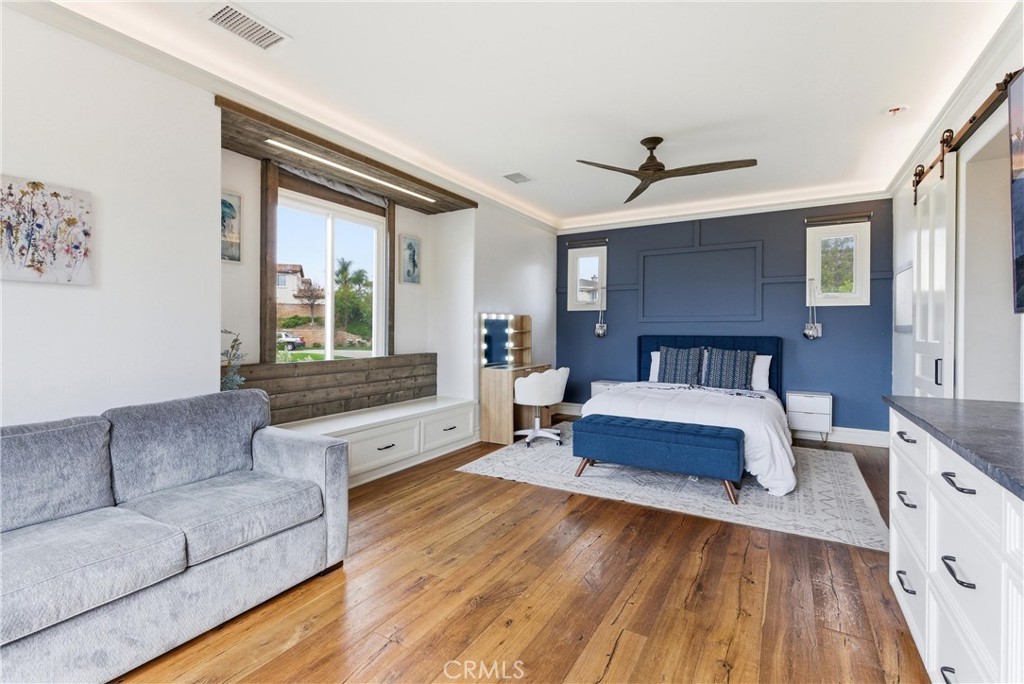 29131 Bouquet Canyon Road Silverado, CA 92676 - Photo 64 of 74 a spacious bedroom with a bed couch and windows