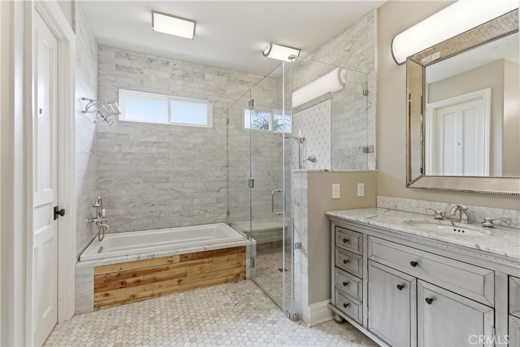 29131 Bouquet Canyon Road Silverado, CA 92676 - Photo 66 of 74 a bathroom with a granite countertop sink mirror bathtub and shower