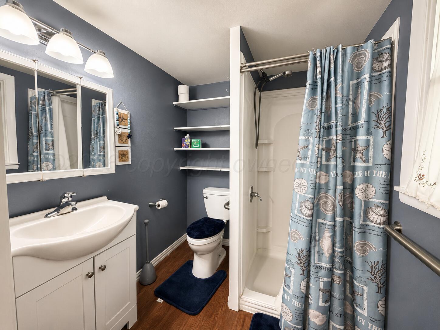 606 South Prospect Street Amarillo, TX 79106 - Photo 12 of 22 a bathroom with a sink toilet and shower