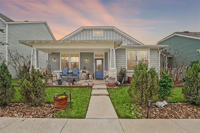 a view of a front of house with a patio