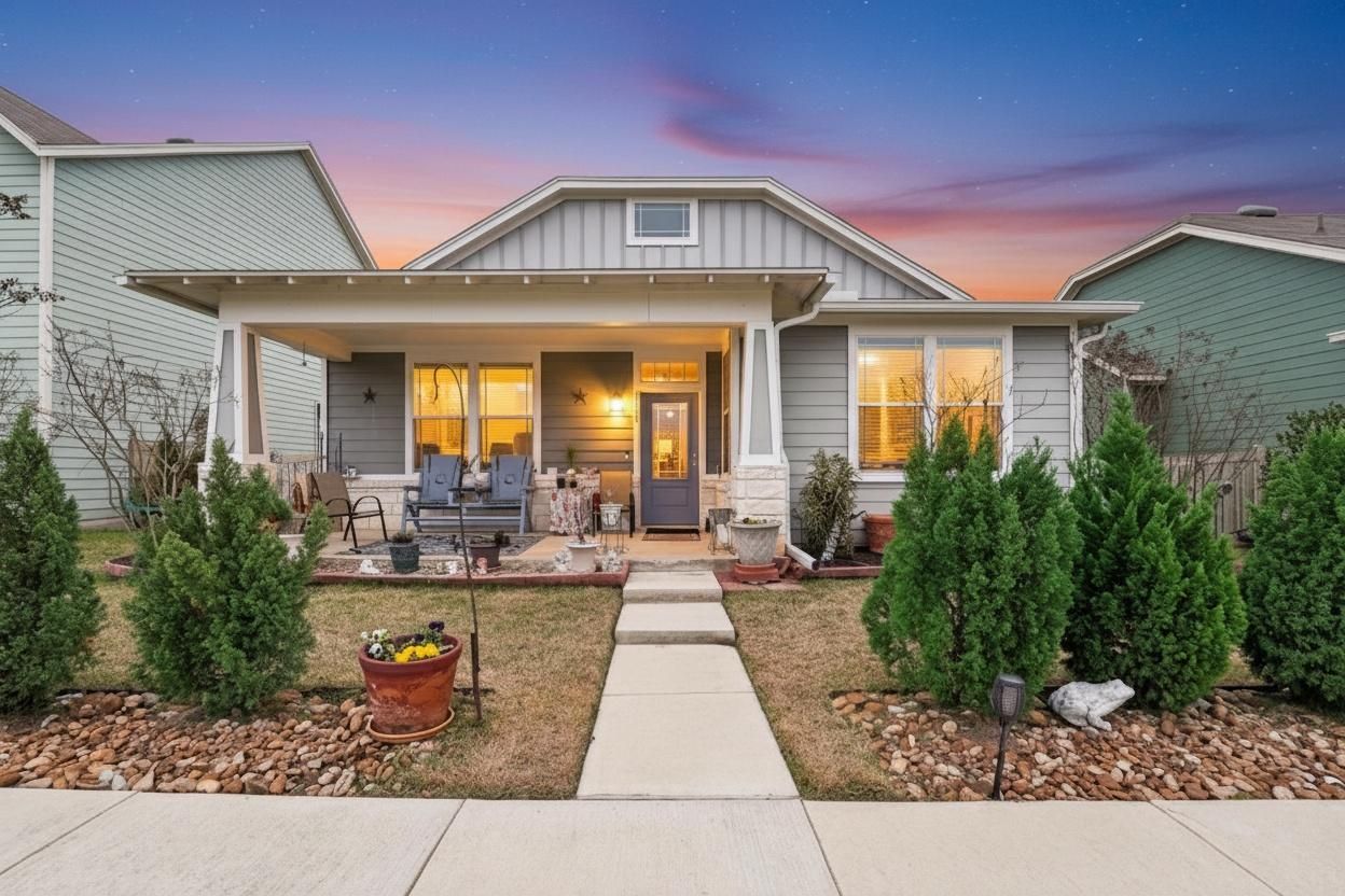 Craftsman house with board and batten siding, covered porch, and a lawn