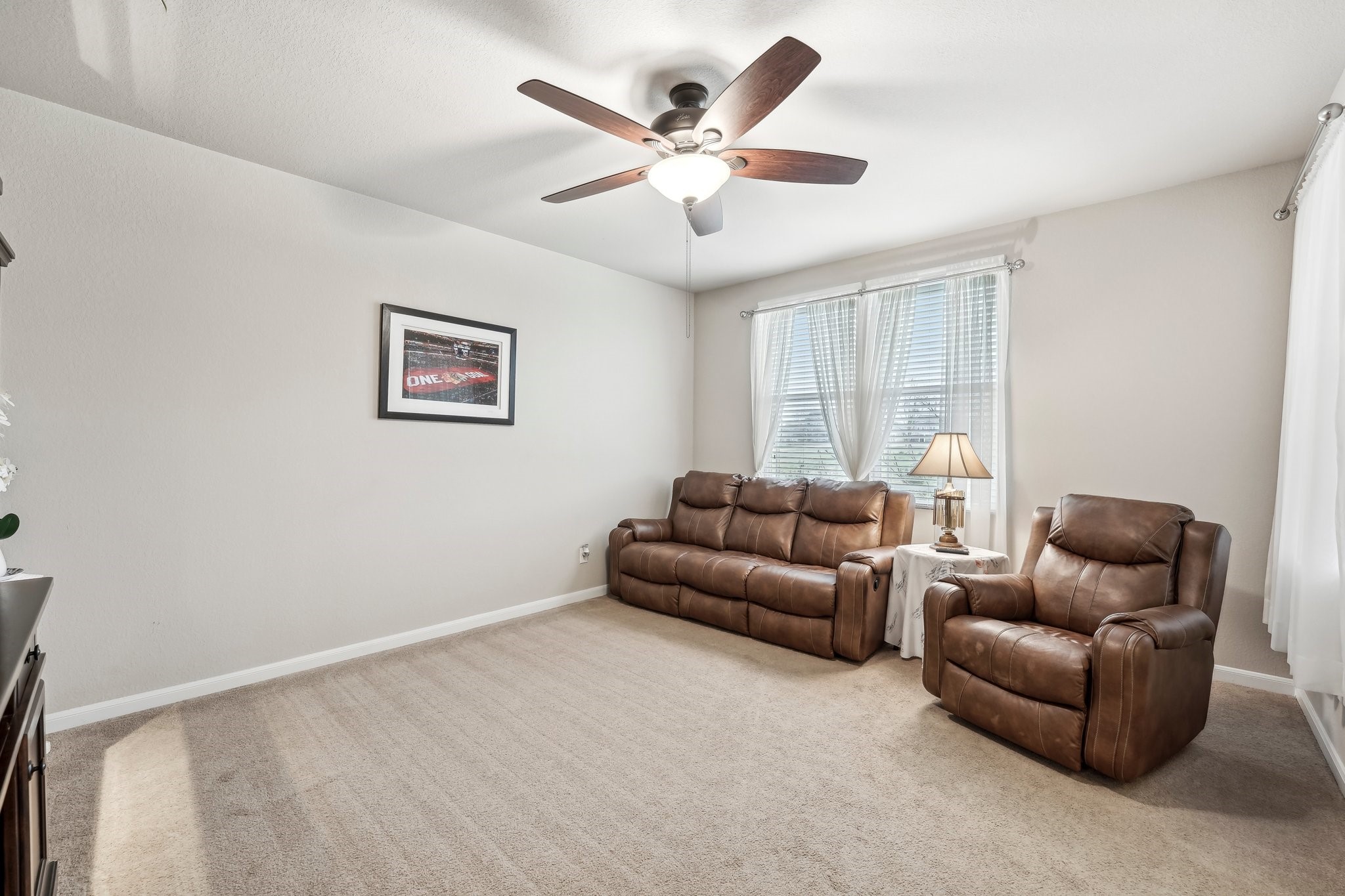 1373 Nevarez Kyle, TX 78640 - Photo 12 of 38 a living room with furniture and ceiling fan