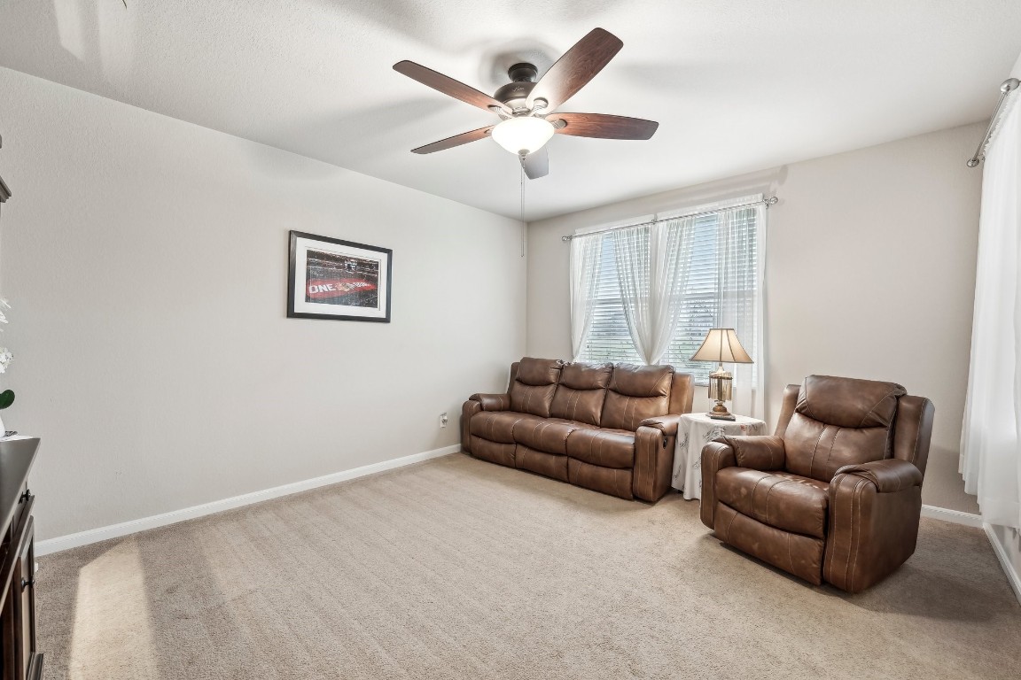 1373 Nevarez Kyle, TX 78640 - Photo 12 of 39 a living room with furniture and ceiling fan
